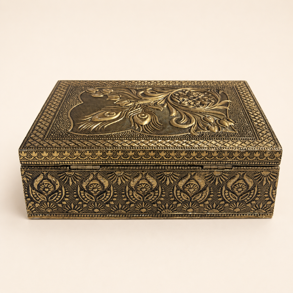 Angled view of the Mayura Bloom antique gold tone box with floral patterned sides