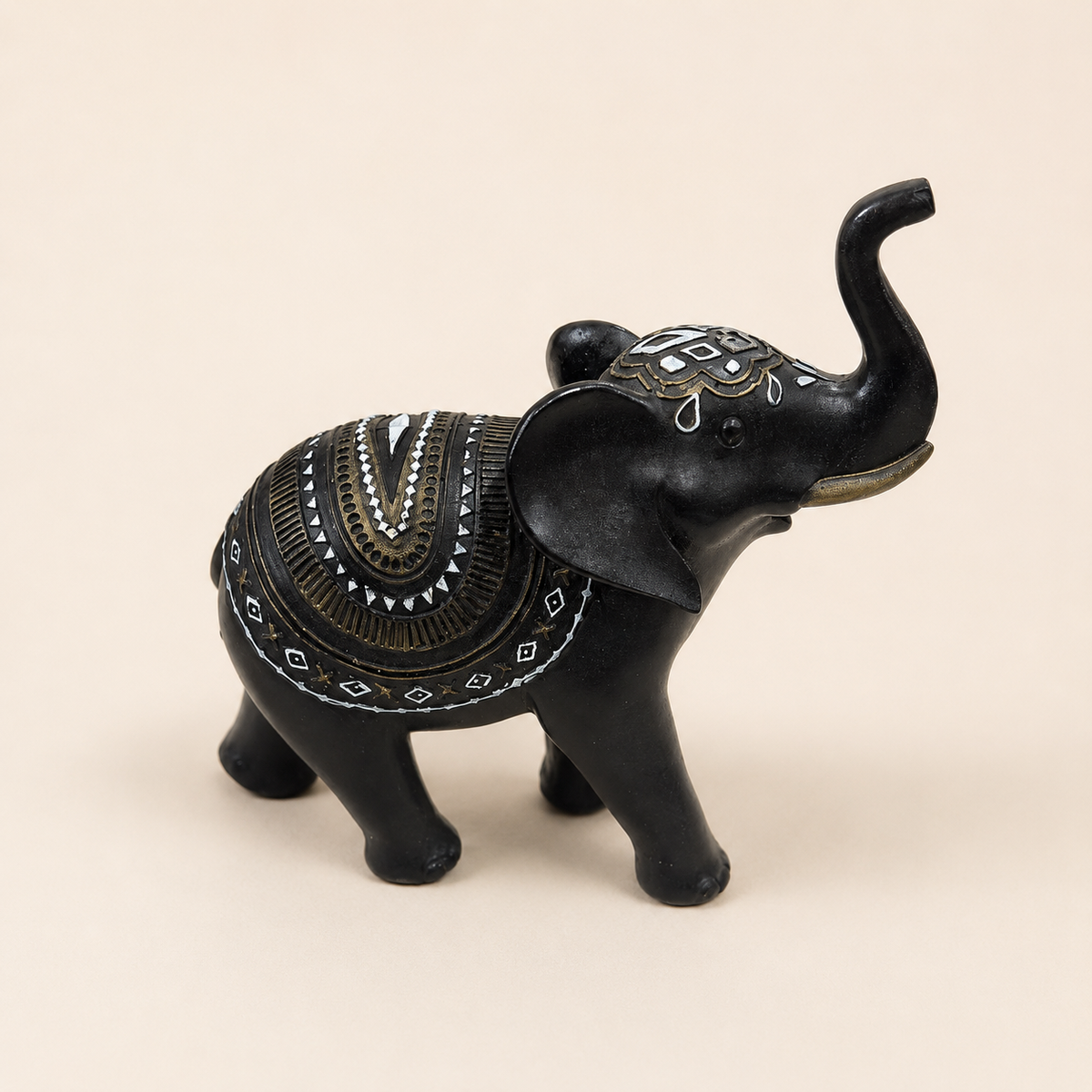 Midnight Mandala Elephant Figurine in black with raised trunk and gold-tone and white geometric details