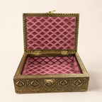 Open Mor Pankh jewellery box with a rose coloured patterned interior and single compartment