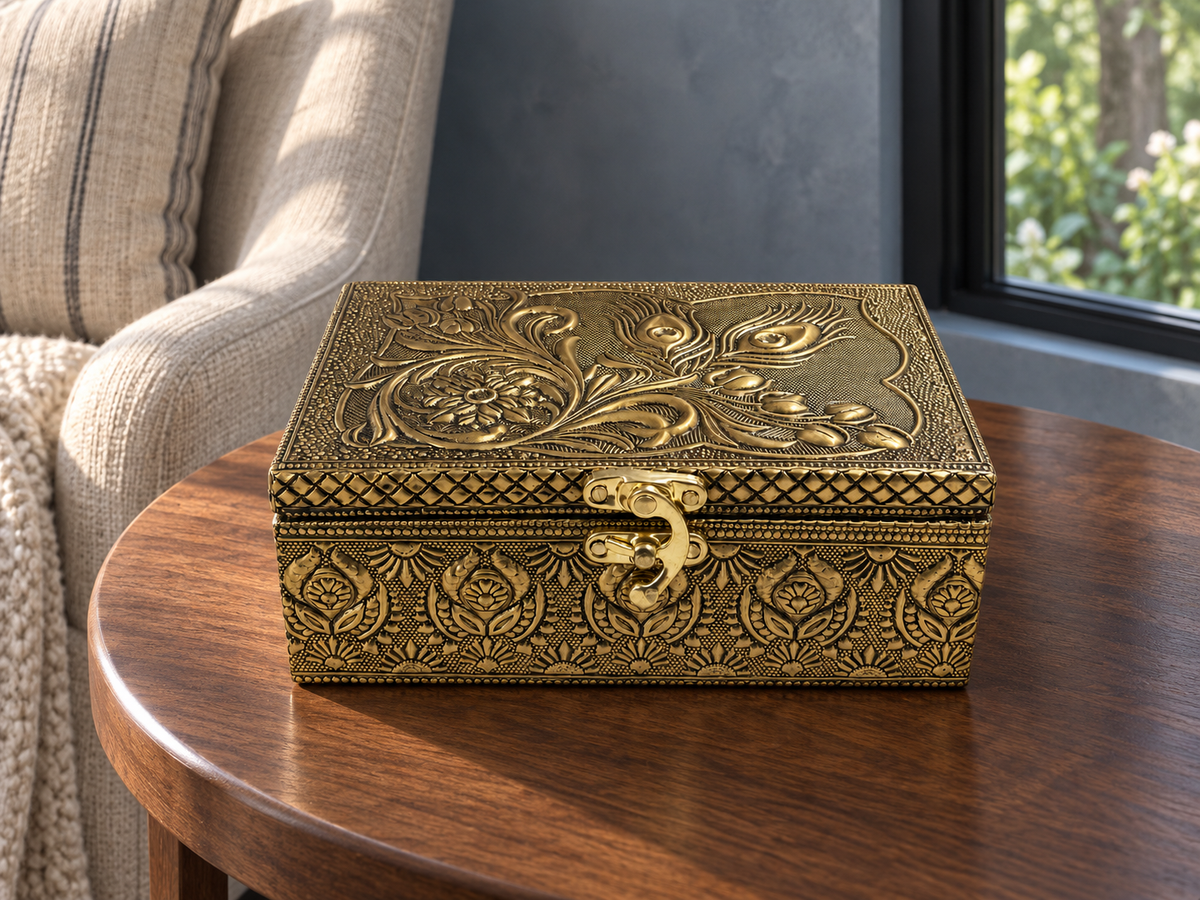 Mor Pankh jewellery box with curved clasp styled on a round wooden table in a reading corner