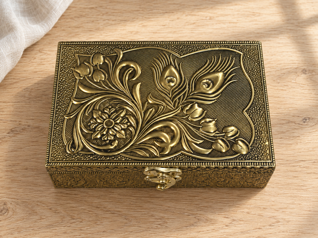 Mor Pankh peacock feather and floral jewellery box displayed on a light wood surface