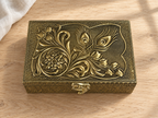 Mor Pankh peacock feather and floral jewellery box displayed on a light wood surface
