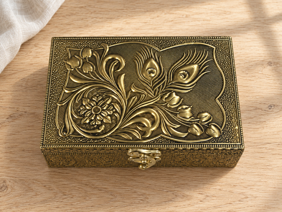 Mor Pankh peacock feather and floral jewellery box displayed on a light wood surface