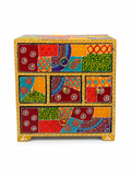 Front view of colourful patchwork jewellery organizer with five closed drawers