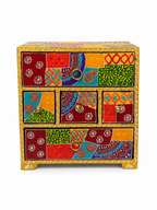 Front view of colourful patchwork jewellery organizer with five closed drawers