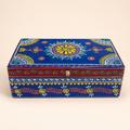 Neel Mandala decorative keepsake box with a blue floral lid, red band and reflective accents, front view