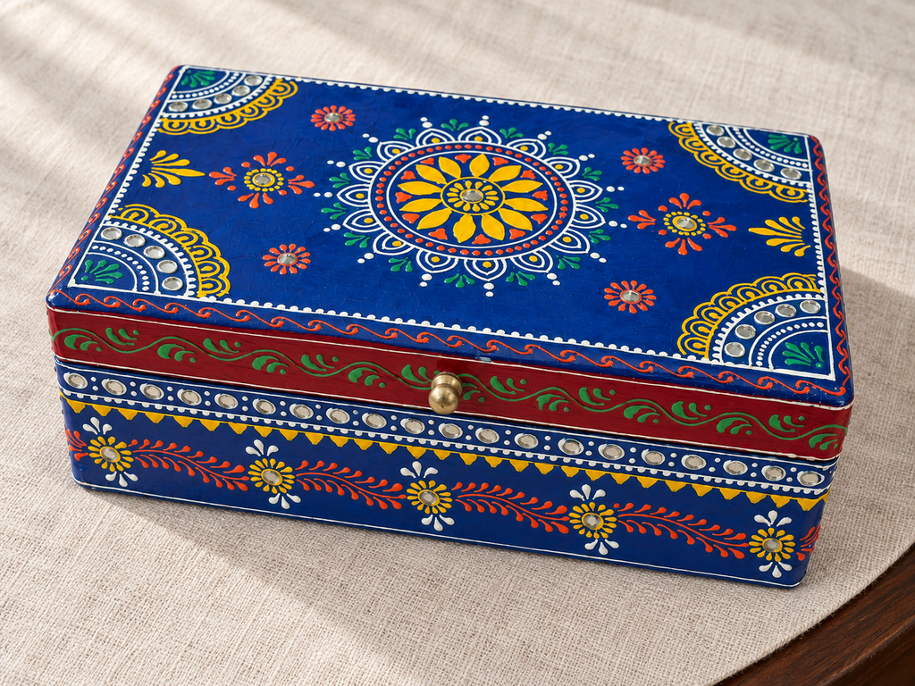 Angled view of Neel Mandala keepsake box showing the yellow floral medallion on the blue lid