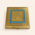 Neel Mayur square jewellery box with a gold-tone peacock motif, blue lid panel and ornate geometric borders