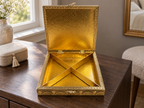 Open Neel Mayur square jewellery organiser with crossed dividers forming four triangular compartments on a dressing table