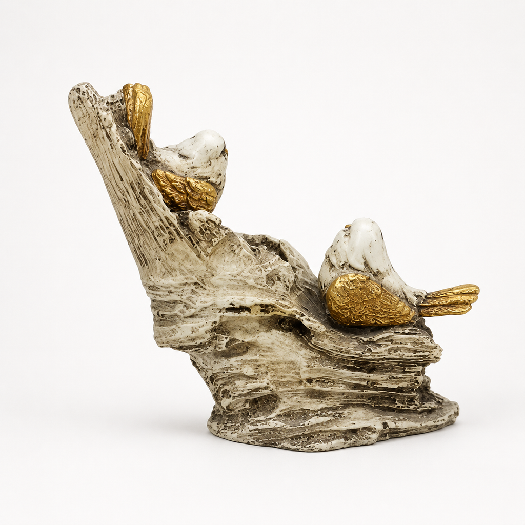 White and gold bird pair decorative sculpture on a branch, back view