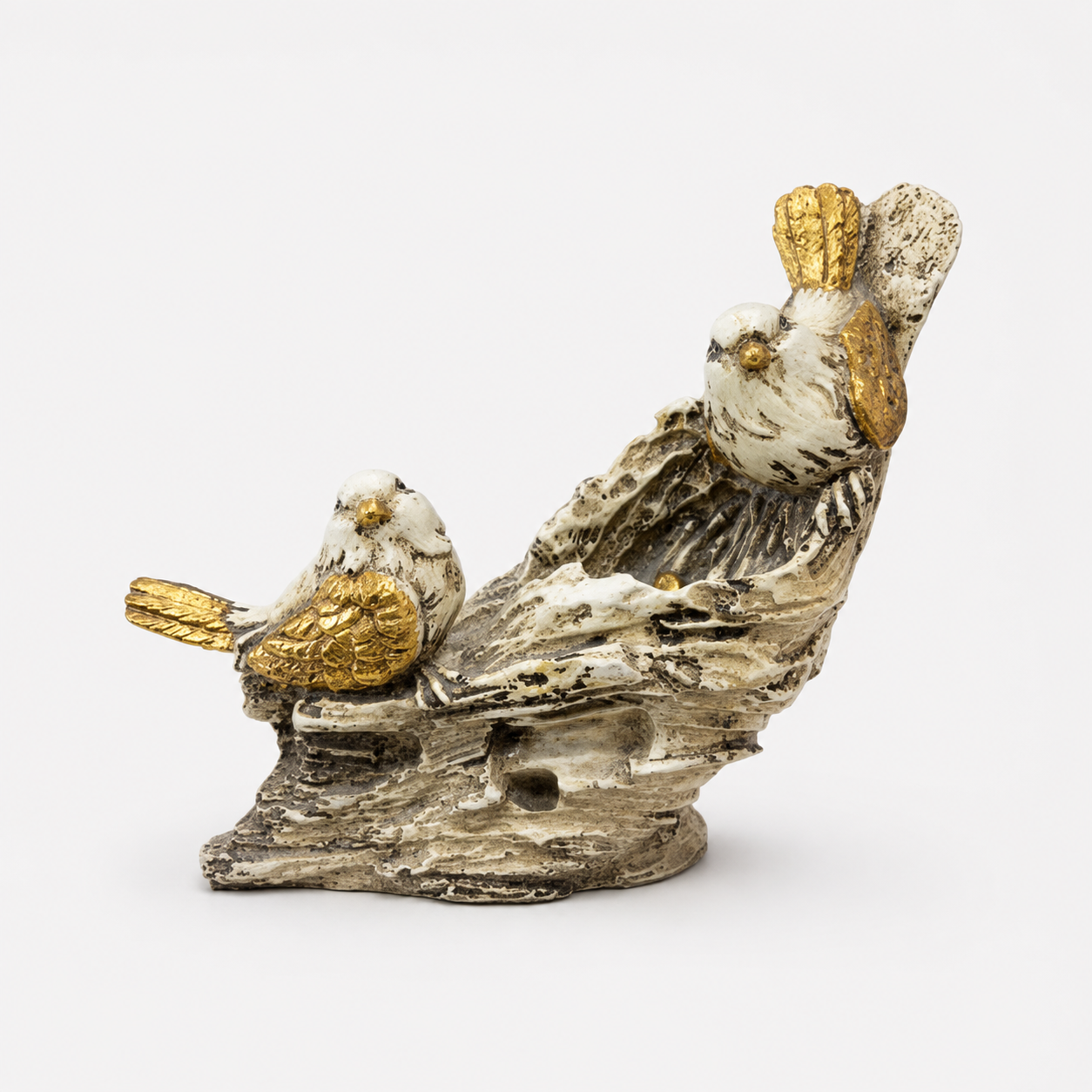 White and gold bird pair decorative sculpture on a branch, front view