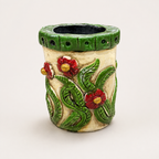 Nomad Bloom face pen stand with red flowers and green leaf detailing, alternate view