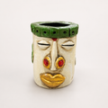 Nomad Bloom ivory and green decorative face pen stand, front view