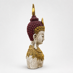 Ornate ivory, gold and burgundy Buddha bust sculpture, side view
