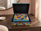 Phool Mosaic nesting box set with the large lid open on a wooden console in morning light