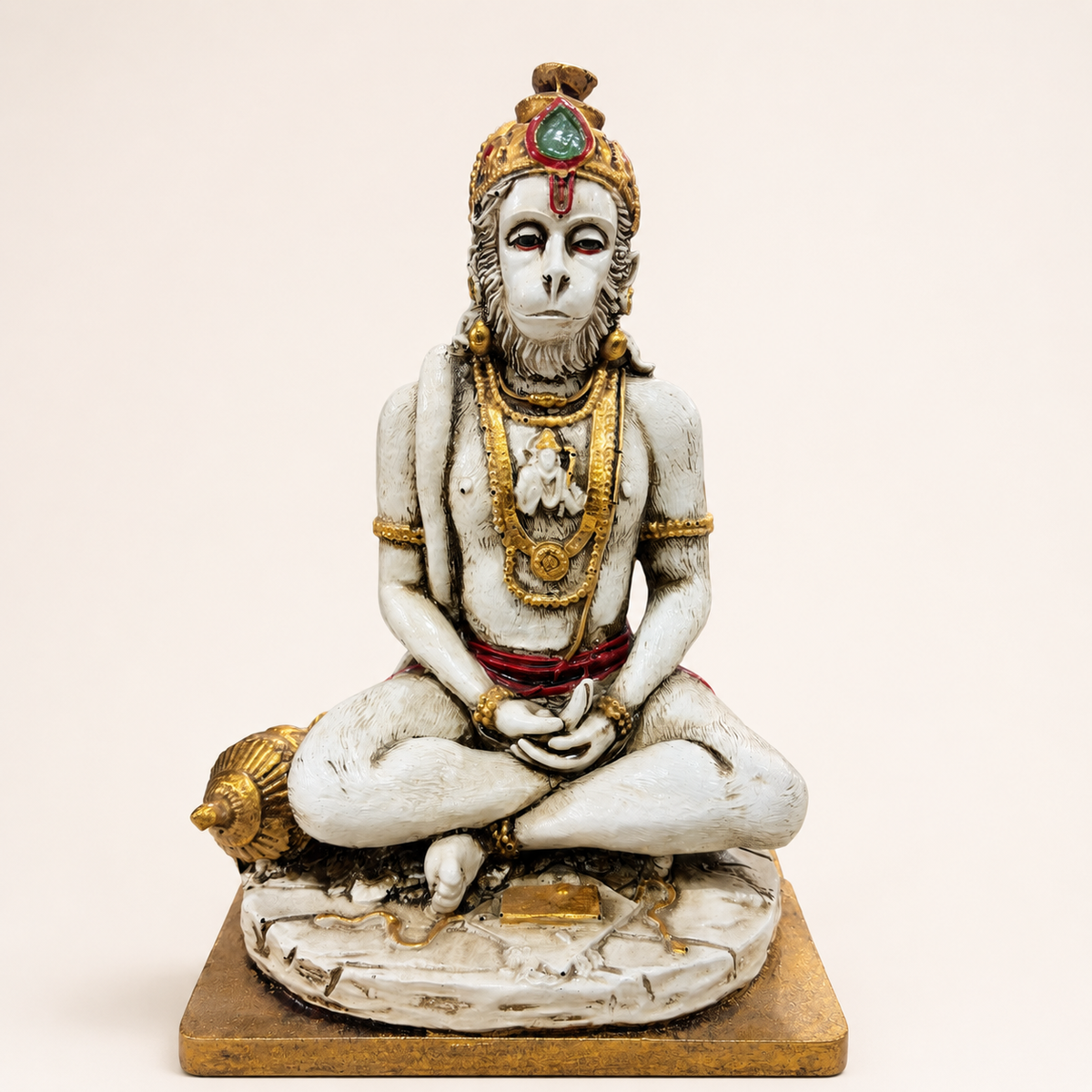 Quiet Devotion meditating Hanuman idol in an ivory-tone and gold-tone finish with red attire, front view