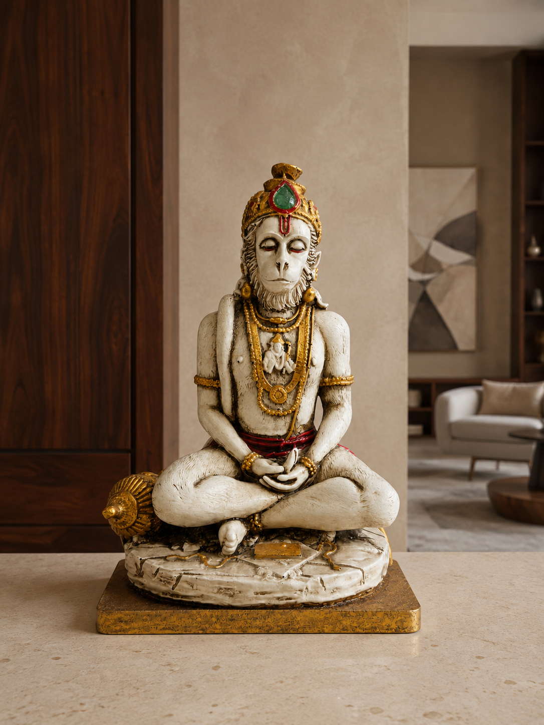 Meditating Hanuman idol displayed on a light stone console in a warm home interior