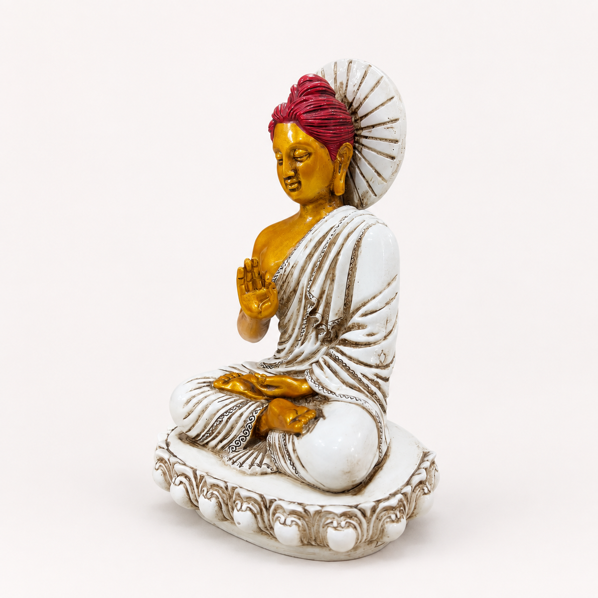 White, gold and red seated Buddha decorative statue, angled view