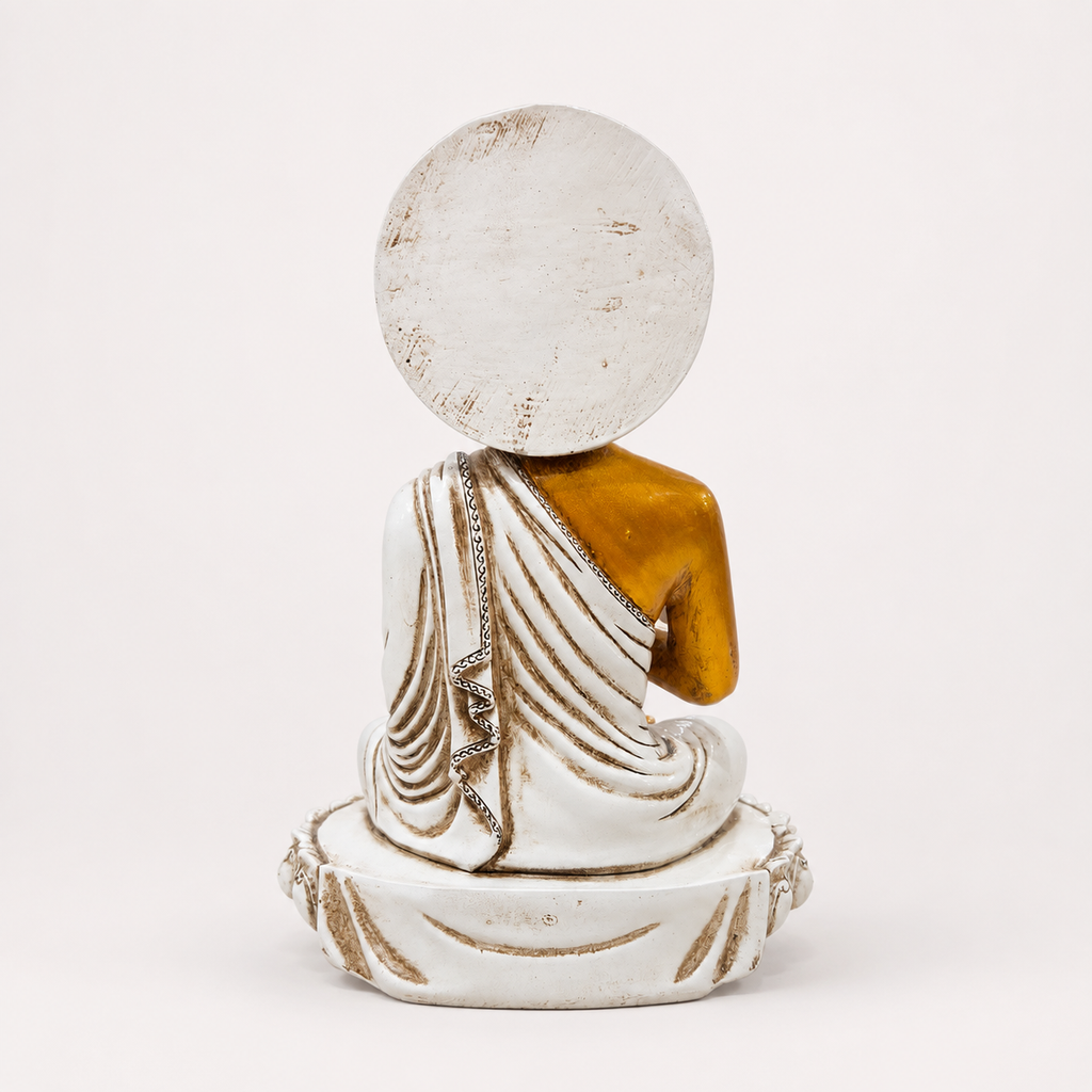 White, gold and red seated Buddha decorative statue, back view