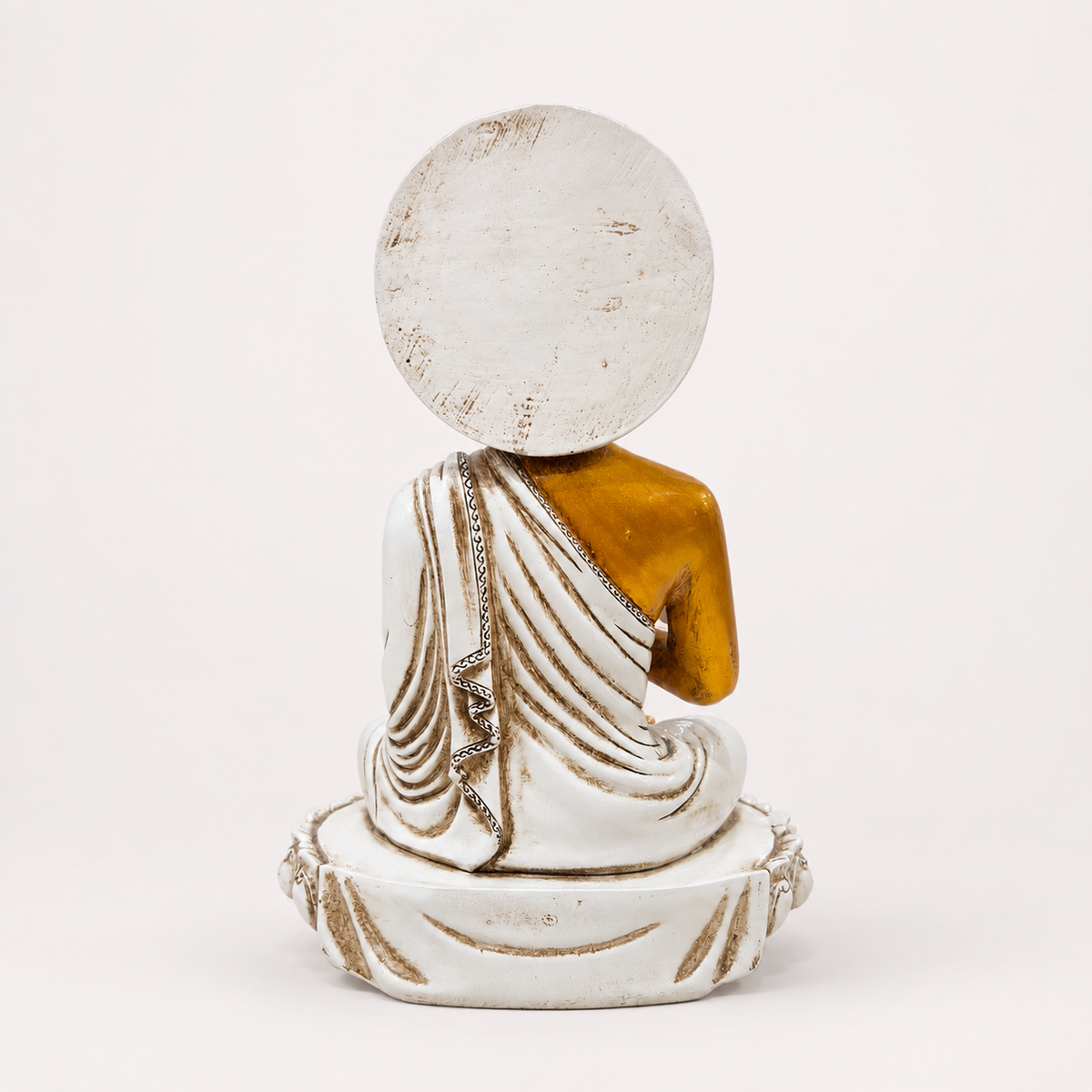 White, gold and red seated Buddha decorative statue, back view