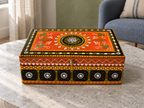 Rang Jyoti keepsake box displayed closed on a round stone table