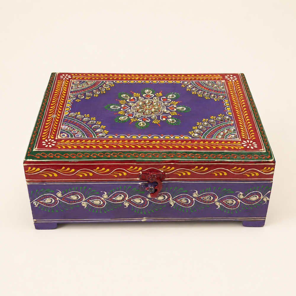 Rang Raas purple keepsake chest with a mirrored floral centre, red and green borders and peacock-inspired front motifs