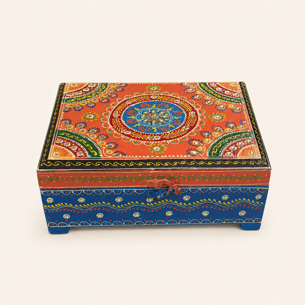 Rang Tarang keepsake chest with an orange floral mandala lid, mirror accents, blue base and curved front clasp