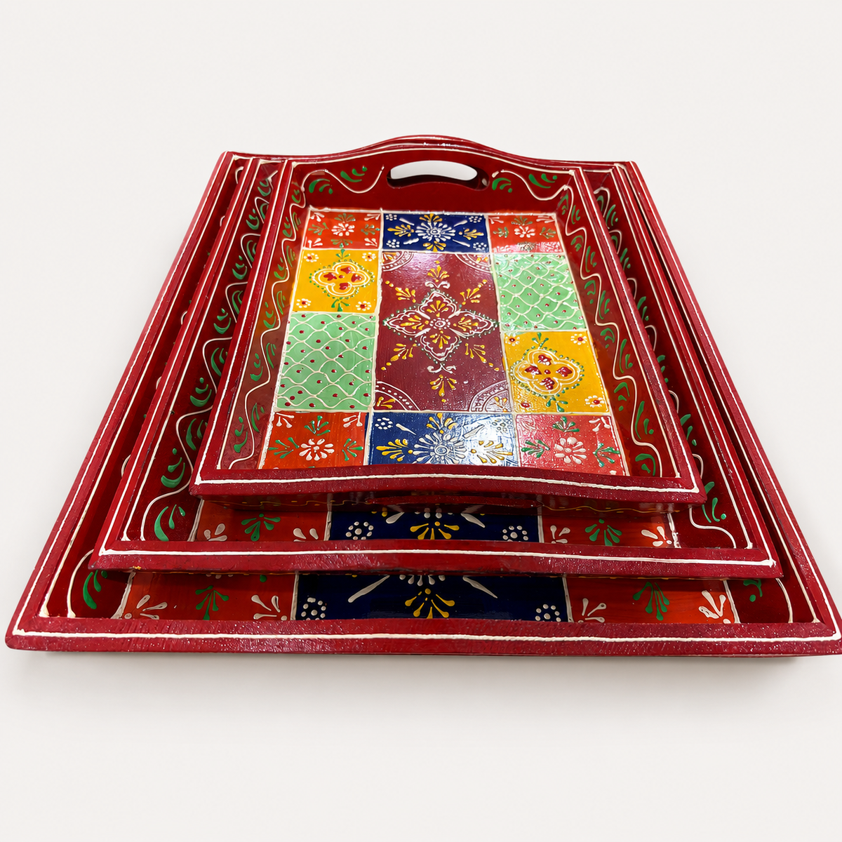 Front view of the Rangoli Bloom floral tray set showing curved rims and cut-out handles