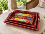Rangoli Bloom tray set styled on a round table in a verandah