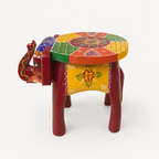 Side view of the colourful elephant-shaped mini decorative stool