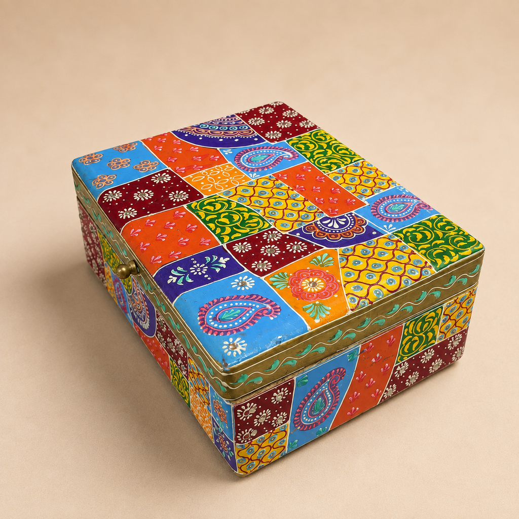 Angled view of the colourful patchwork lid and patterned sides of the larger decorative storage box