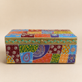 Front view of the larger Rangoli Patchwork storage box with multicolour paisley and floral panels, gold-tone trim and a round lid knob