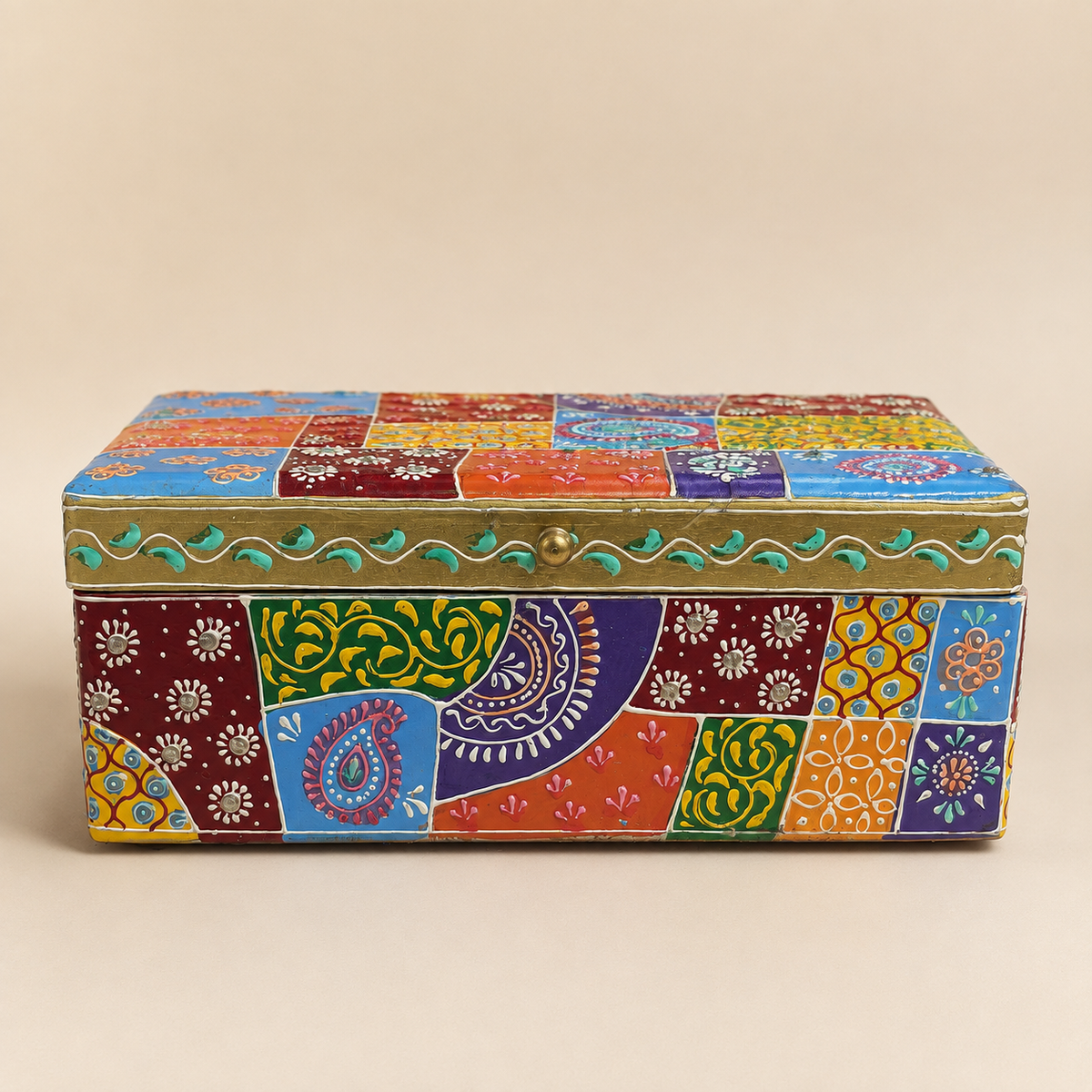 Front view of the larger Rangoli Patchwork storage box with multicolour paisley and floral panels, gold-tone trim and a round lid knob