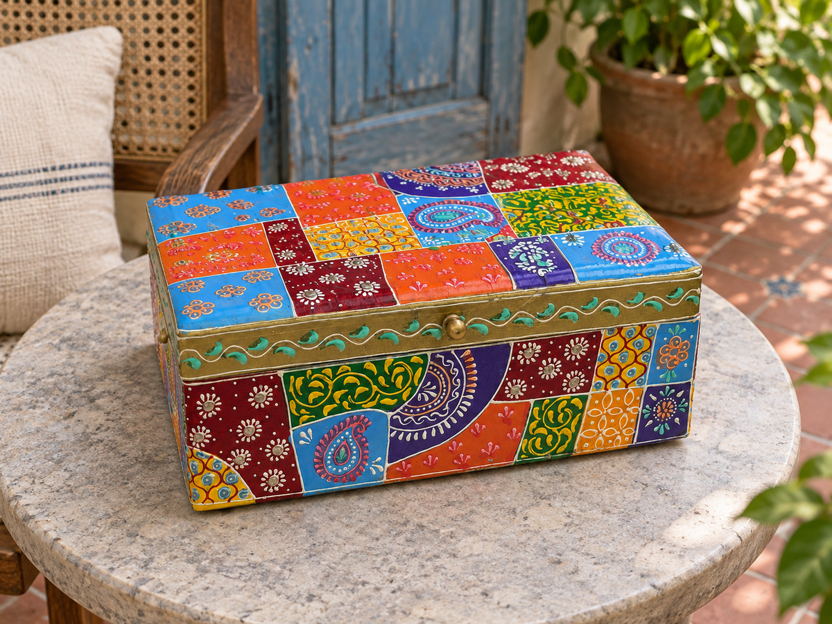 Colourful paisley and floral storage box displayed on a round stone table