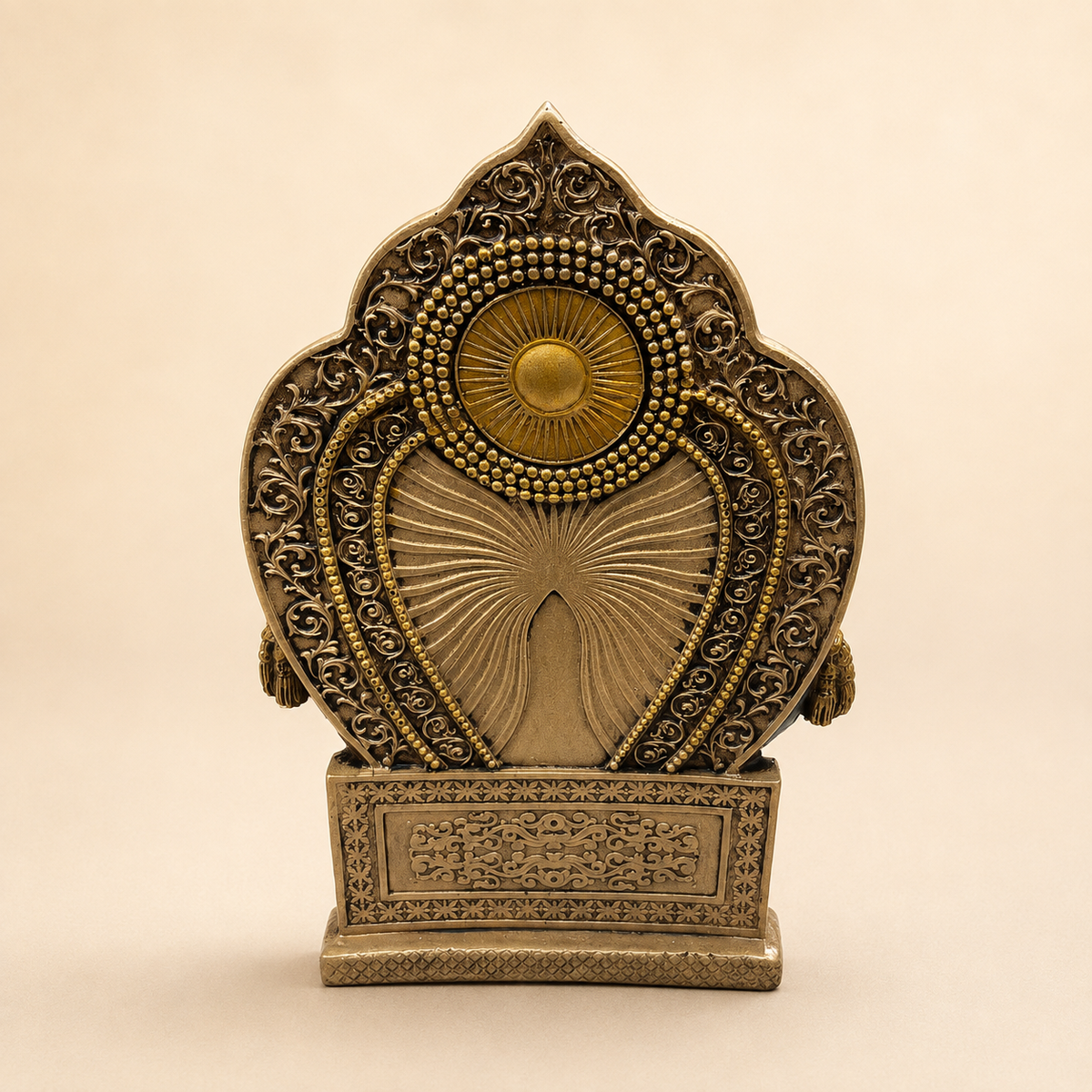 Rear view of the Lord Kuber idol showing the detailed floral scrollwork, beaded arch and gold-tone throne