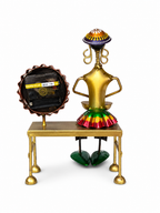 Rear view of folk drummer table clock showing quartz clock movement