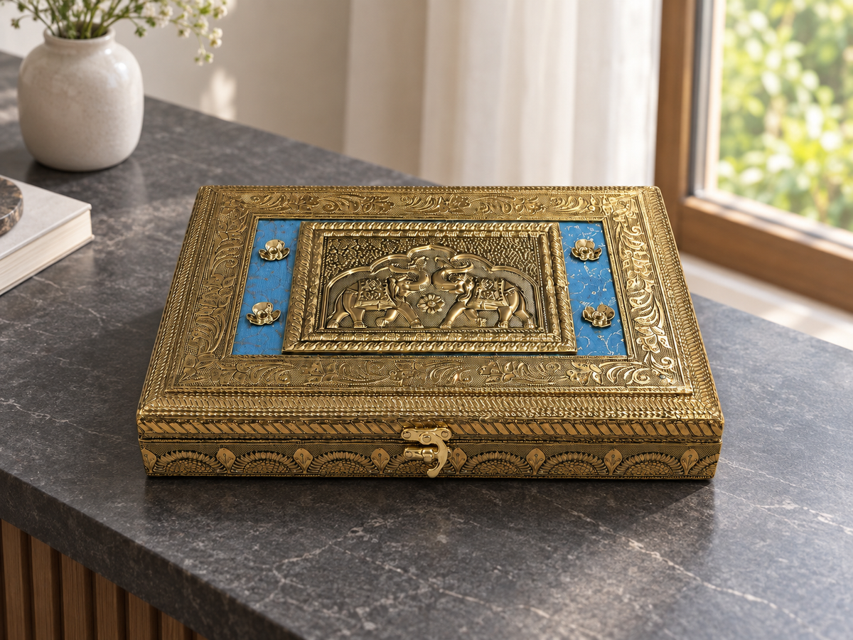 Royal Gaj blue and gold-tone jewellery box displayed on a dark stone console