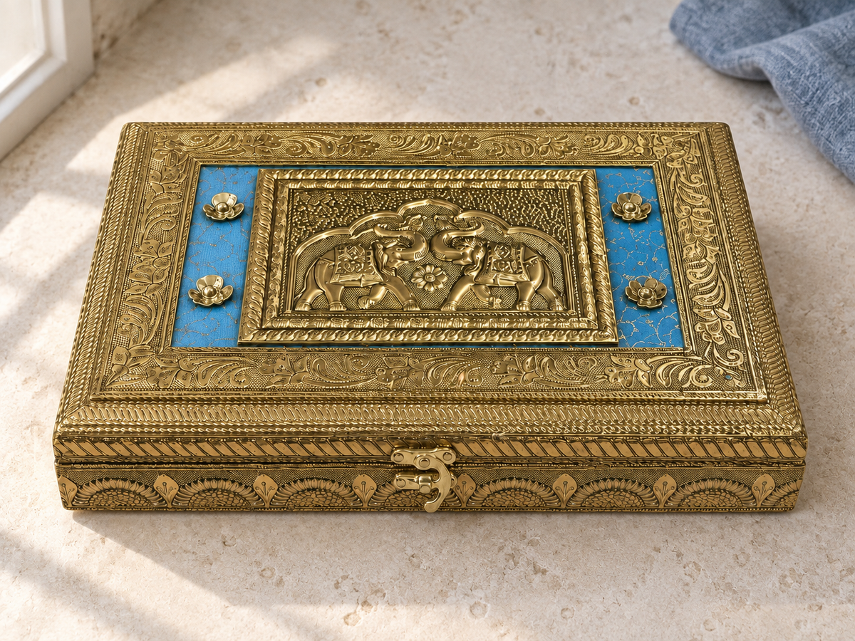 Twin-elephant motif and blue floral panels on the Royal Gaj jewellery box, displayed on cream stone