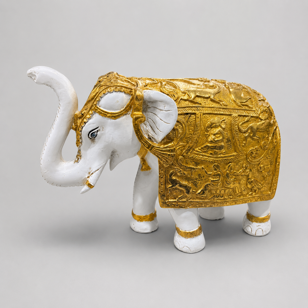 Royal Procession ivory and gold elephant sculpture with raised trunk, front side view