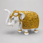 Royal Procession ivory and gold elephant sculpture with raised trunk, front side view