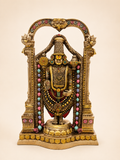 Tirupati Balaji idol with a gold-tone floral arch, colourful garlands and an ornate pedestal, front view