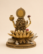 Rear view of the Ganga Maa idol showing flowing hair, ornate halo and layered lotus petals