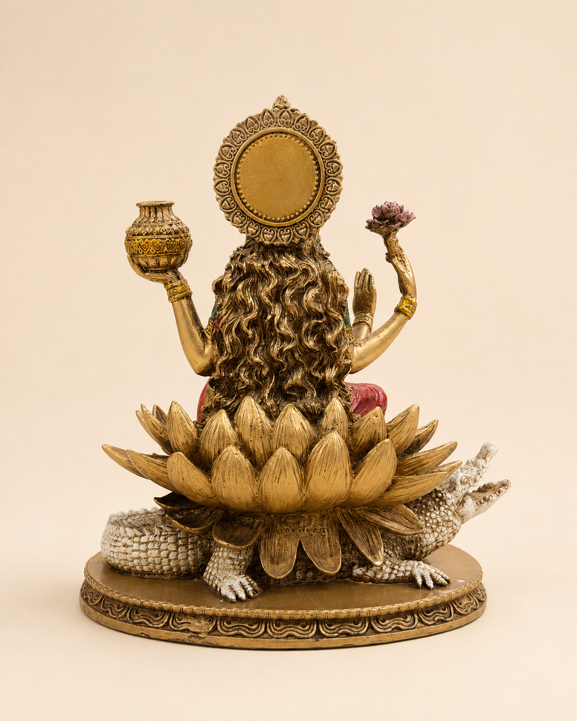 Rear view of the Ganga Maa idol showing flowing hair, ornate halo and layered lotus petals