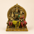 Sacred Togetherness Shiva Parvati Ganesha idol with an ornate circular backdrop and colourful attire, front view