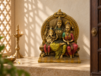 Sacred Togetherness Shiva Parvati Ganesha idol in a sunlit mandir with a tall lamp