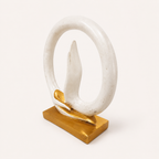 Serene Mudra ivory and gold circular decorative sculpture, angled view