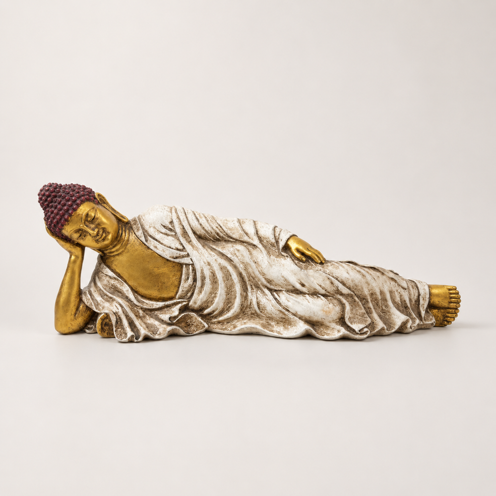 Ivory, gold, and burgundy reclining Buddha sculpture, front view