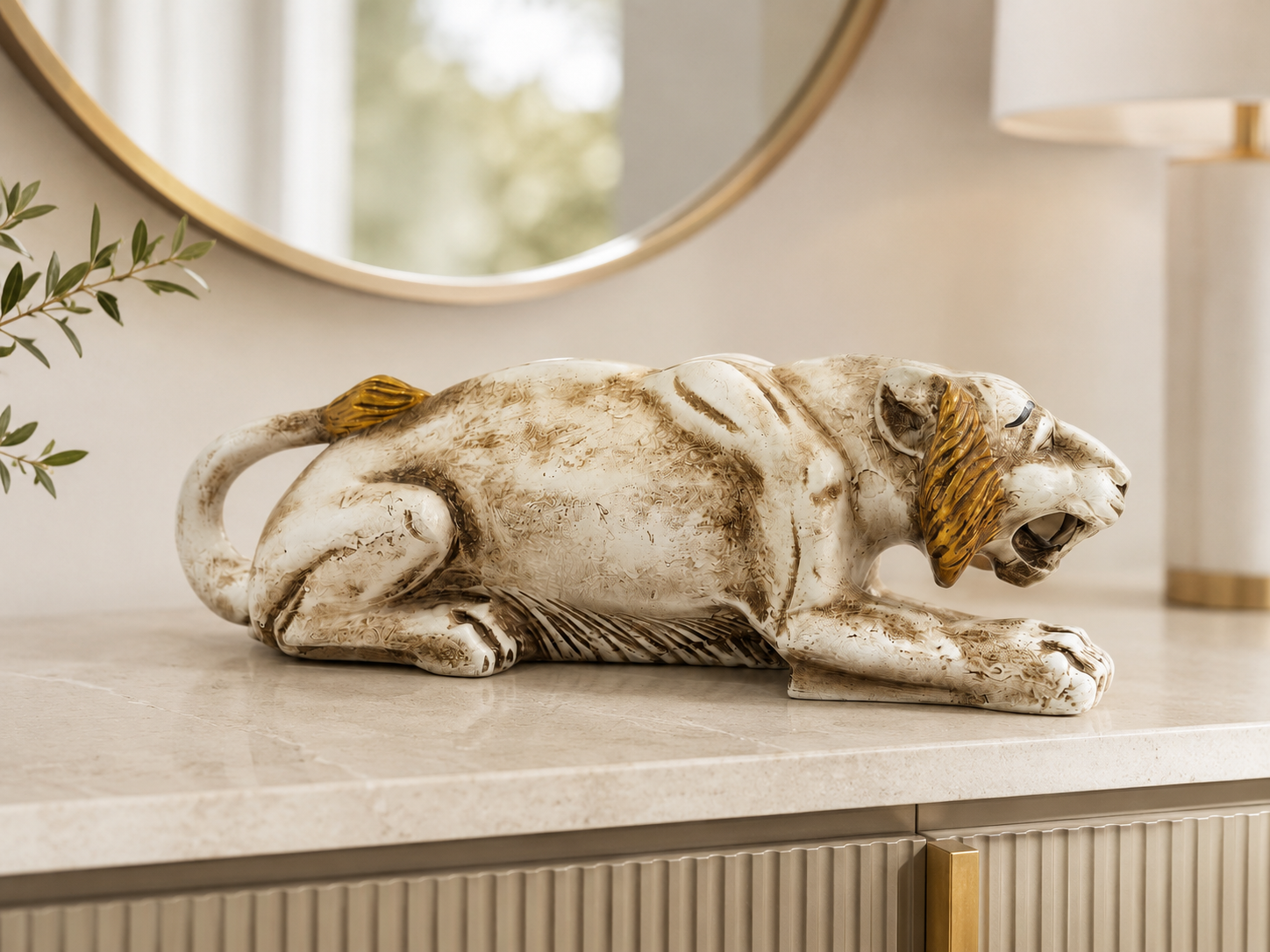 White and gold prowling tiger sculpture styled on a light console