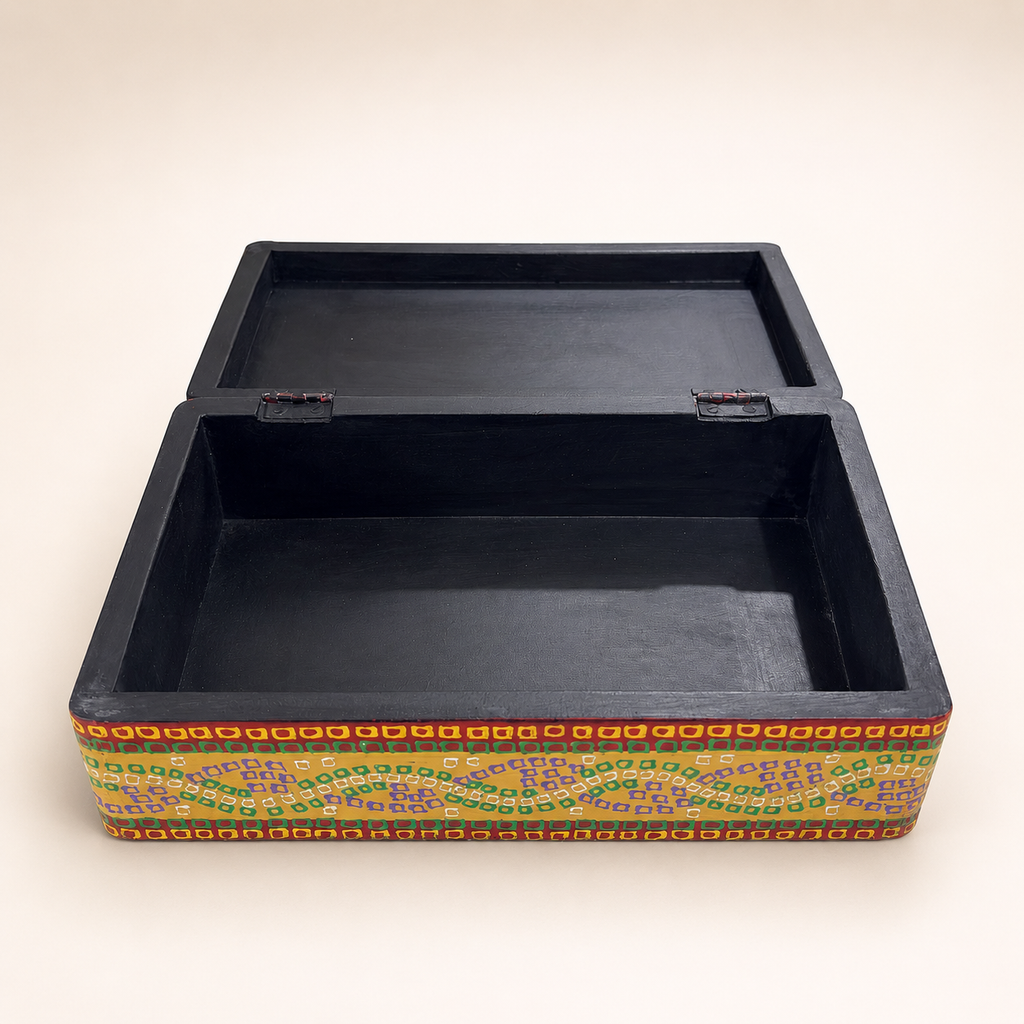 Surya Mandala keepsake box with hinged lid open, showing the black interior and storage compartment