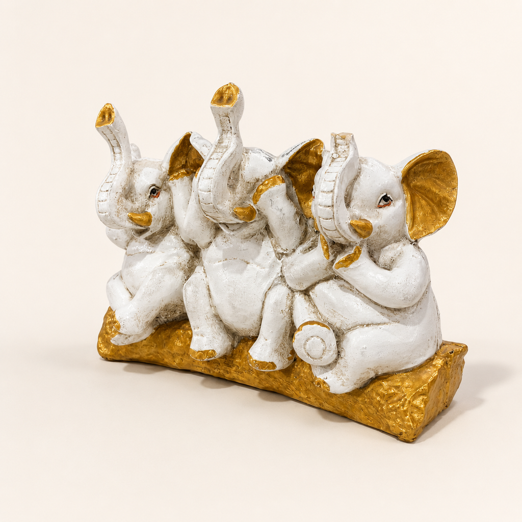 Three Wise Elephants ivory and gold decorative sculpture, right angled view